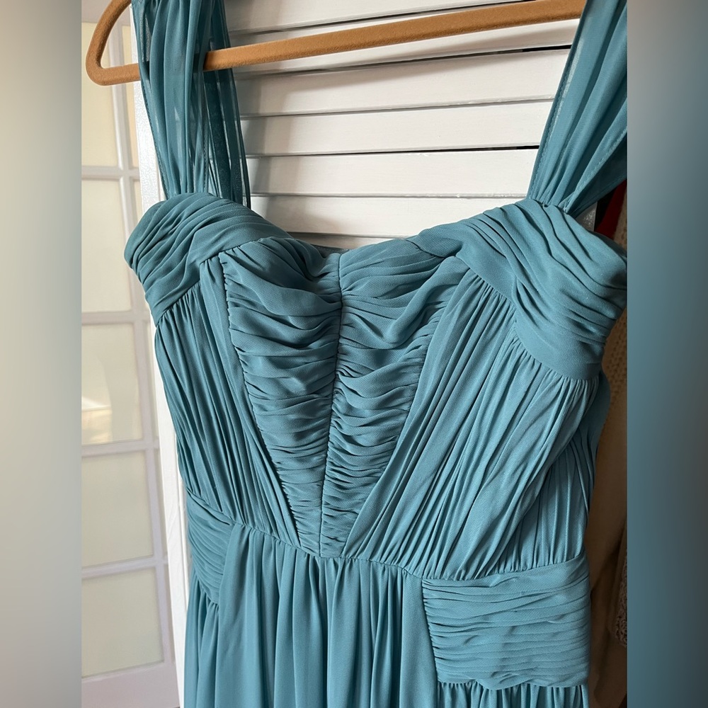Gorgeously flowy designer gown. Only worn twice.  Lightweight and comfortable.